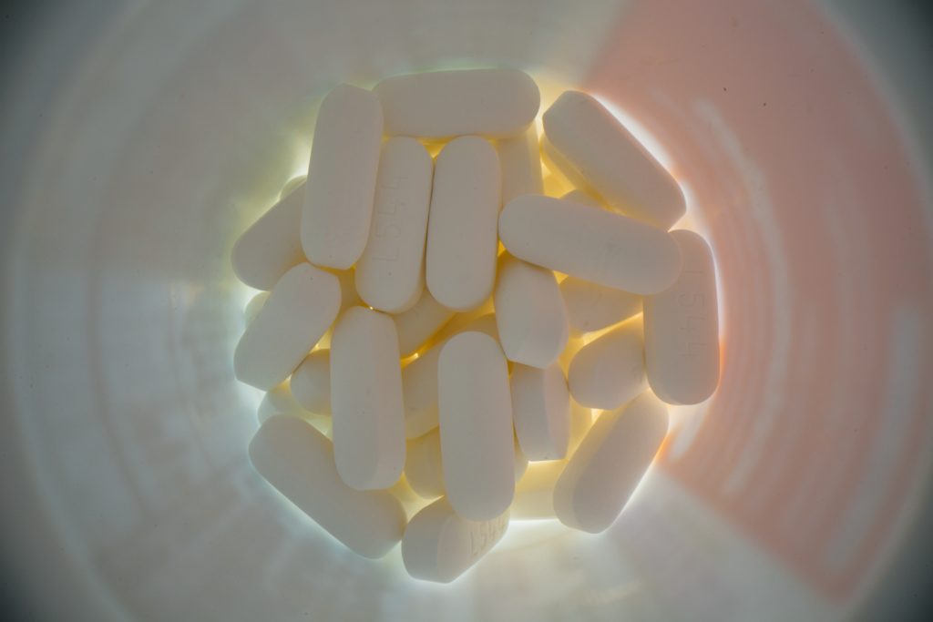 white capsules in bottle