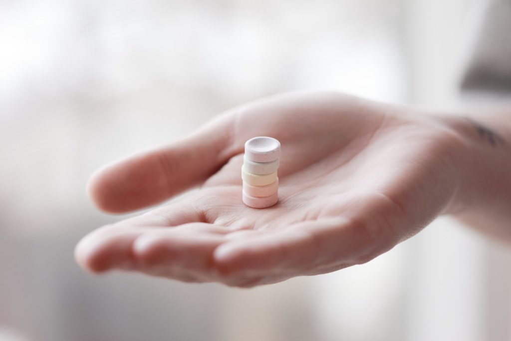 woman holding medicine